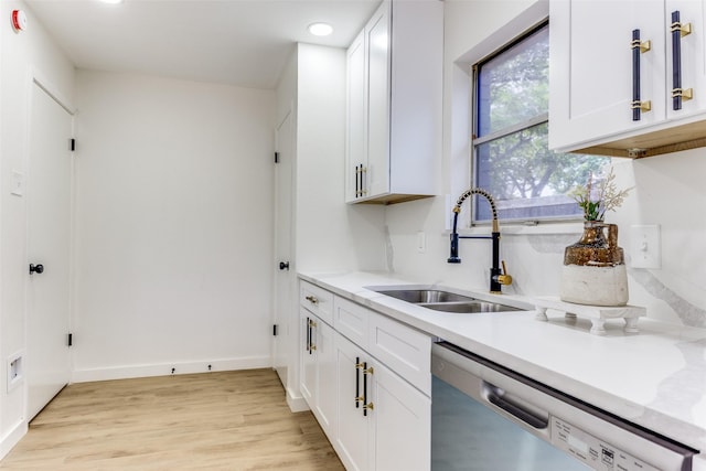 806 Brookshire Cir, Garland, TX 75043 - kitchen with stainless steel dishwasher, a sink, light wood finished floors, light countertops, and recessed lighting