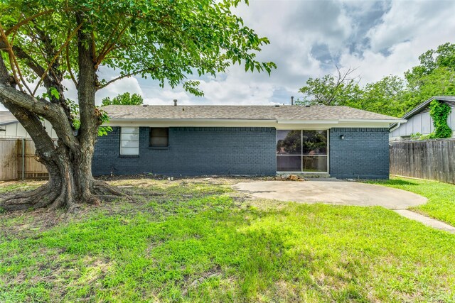806 Brookshire Cir, Garland, TX 75043 - back of house with brick siding and a patio area
