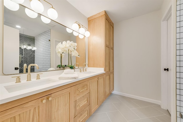520 Oakcrest Dr, Coppell, TX 75019 - full bathroom featuring double vanity, tile patterned flooring, a tile shower, and baseboards