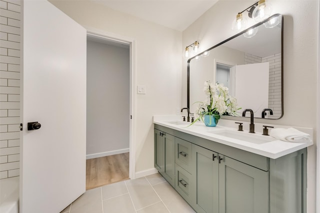 520 Oakcrest Dr, Coppell, TX 75019 - full bathroom with double vanity, tile patterned flooring, and baseboards