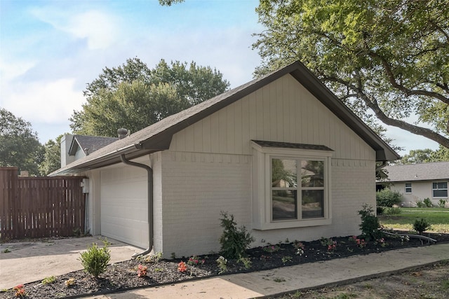 520 Oakcrest Dr, Coppell, TX 75019 - view of side of property with brick siding, an attached garage, and driveway