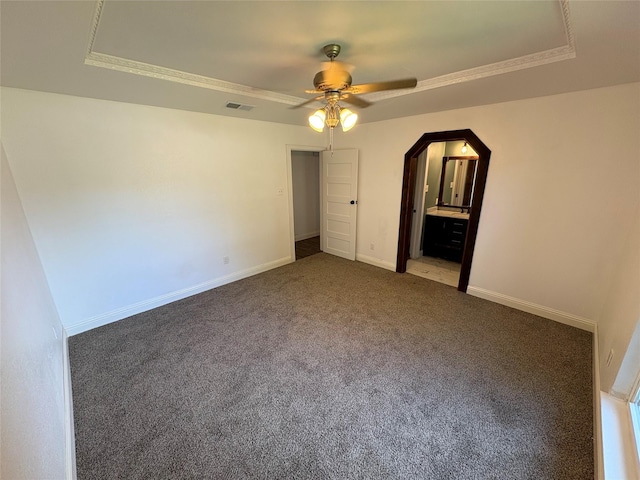 6805 Eagle Rock Dr, Fort Worth, TX 76133 - unfurnished bedroom with a tray ceiling, carpet, crown molding, baseboards, and arched walkways