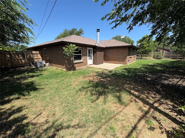 6805 Eagle Rock Dr, Fort Worth, TX 76133 - back of house with brick siding, cooling unit, and a patio area