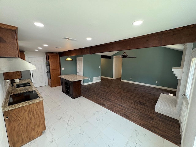 6805 Eagle Rock Dr, Fort Worth, TX 76133 - kitchen with black appliances, a center island, recessed lighting, a ceiling fan, and a sink