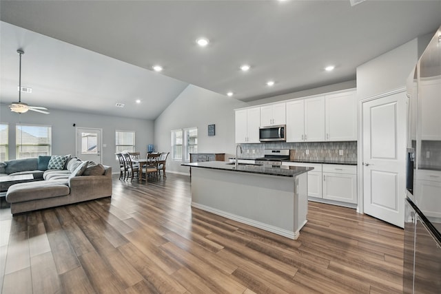 5637 Castle Peak Bnd, Fort Worth, TX 76126 - kitchen with stainless steel appliances, dark countertops, healthy amount of natural light, open floor plan, and recessed lighting