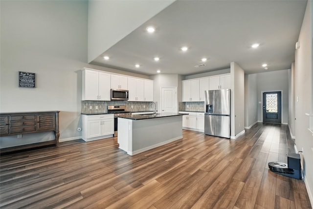 5637 Castle Peak Bnd, Fort Worth, TX 76126 - kitchen with appliances with stainless steel finishes, dark countertops, a sink, decorative backsplash, and recessed lighting