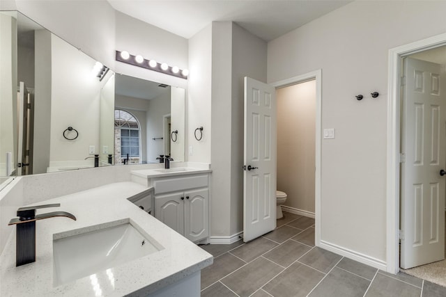5312 Bellis Dr, Fort Worth, TX 76244 - full bath featuring double vanity, toilet, and baseboards