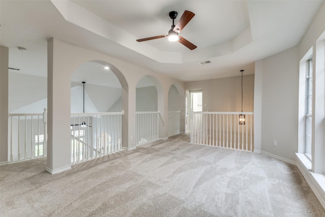 5312 Bellis Dr, Fort Worth, TX 76244 - carpeted empty room with ceiling fan, healthy amount of natural light, a raised ceiling, and a smoke detector