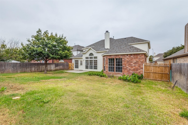 5312 Bellis Dr, Fort Worth, TX 76244 - back of house featuring brick siding, a patio, a shingled roof, and a chimney