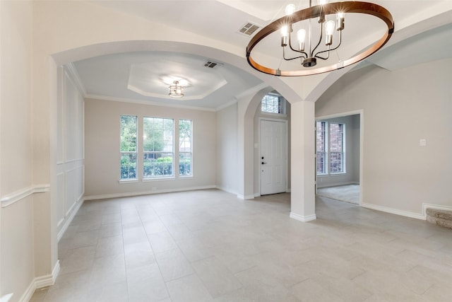 5312 Bellis Dr, Fort Worth, TX 76244 - spare room with arched walkways, a raised ceiling, a chandelier, and baseboards