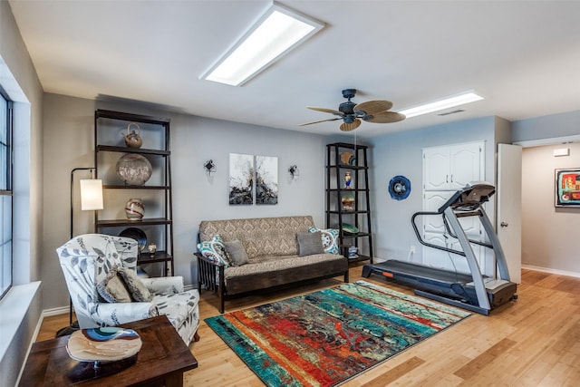 1520 Papeete Dr, Plano, TX 75075 - living area featuring wood finished floors, baseboards, and ceiling fan