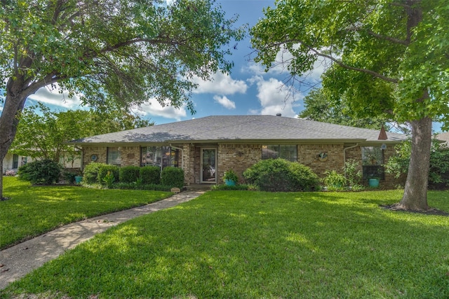 1520 Papeete Dr, Plano, TX 75075 - single story home featuring a front yard, brick siding, and a shingled roof