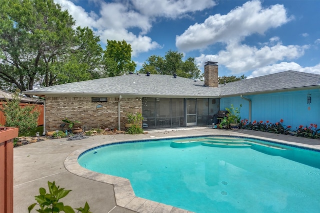 1520 Papeete Dr, Plano, TX 75075 - view of swimming pool with a patio area and a sunroom