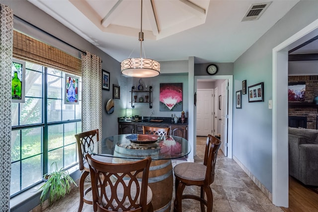 1520 Papeete Dr, Plano, TX 75075 - dining room featuring a brick fireplace and baseboards