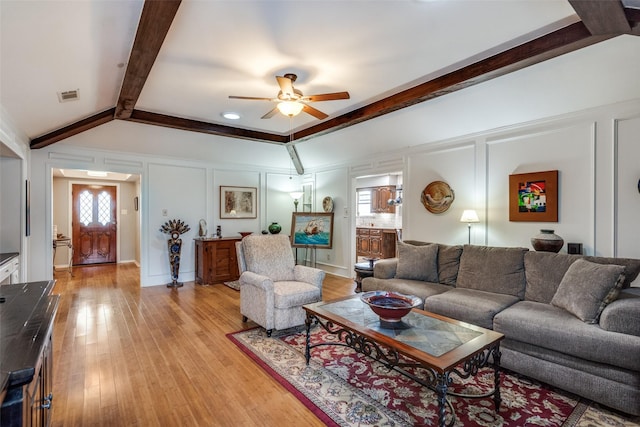 1520 Papeete Dr, Plano, TX 75075 - living area with a decorative wall, a ceiling fan, and light wood finished floors