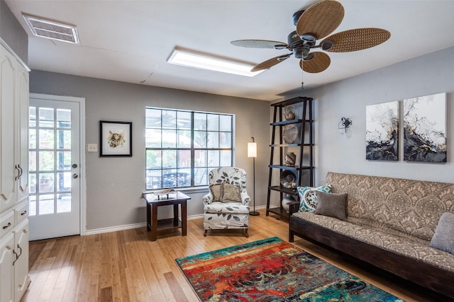 1520 Papeete Dr, Plano, TX 75075 - sitting room with plenty of natural light, light wood-style flooring, ceiling fan, and baseboards