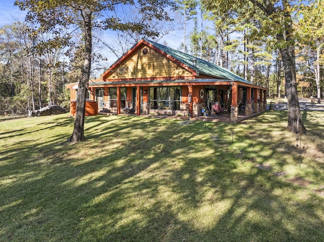 1057 Silver Lake Cir, Mount Pleasant, TX 75455 - rear view of house featuring a yard and stone siding