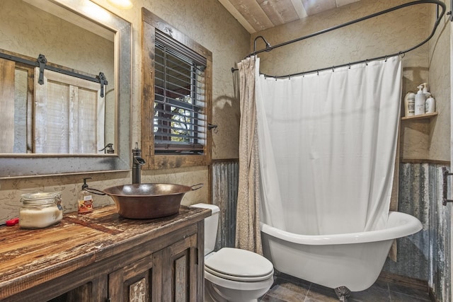 1057 Silver Lake Cir, Mount Pleasant, TX 75455 - bathroom featuring vanity, toilet, and shower / bath combo with shower curtain