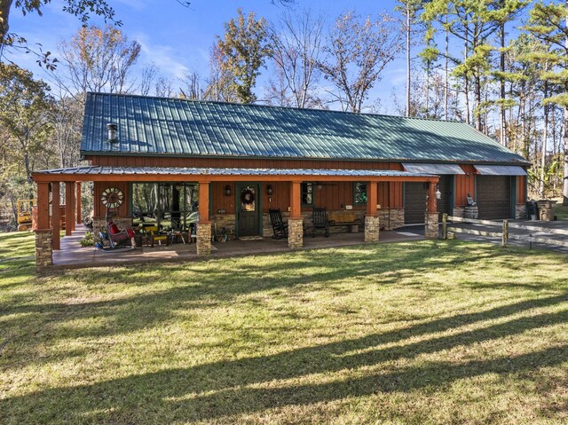 1057 Silver Lake Cir, Mount Pleasant, TX 75455 - rear view of property featuring stone siding, metal roof, and a porch