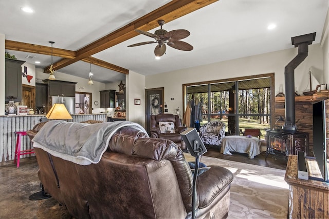 1057 Silver Lake Cir, Mount Pleasant, TX 75455 - carpeted living area with a wood stove, ceiling fan, and recessed lighting