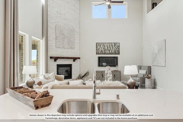 409 Atlas Cedar Dr, Glenn Heights, TX 75154 - living room with a towering ceiling, ceiling fan, and a stone fireplace