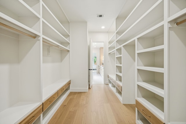 6244 Richmond Ave, Dallas, TX 75214 - walk in closet featuring light wood finished floors