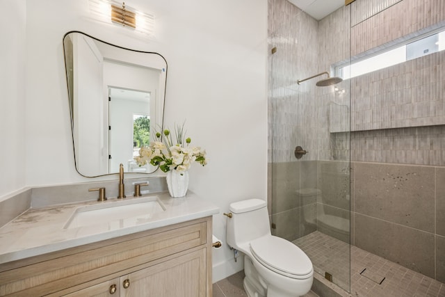 6244 Richmond Ave, Dallas, TX 75214 - bathroom featuring toilet, walk in shower, vanity, and baseboards