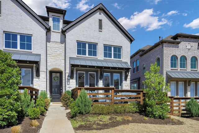 363 Somerville Dr, Mckinney, TX 75071 - view of front facade with french doors, a standing seam roof, and stone siding