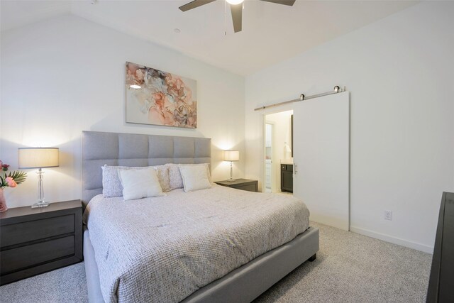 363 Somerville Dr, Mckinney, TX 75071 - bedroom featuring a barn door, carpet flooring, ensuite bath, vaulted ceiling, and ceiling fan