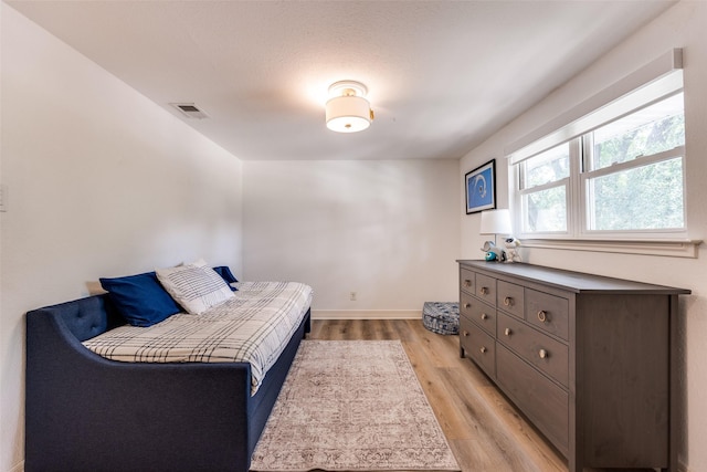 2617 Beechmont Dr, Dallas, TX 75228 - bedroom featuring light wood-type flooring and baseboards