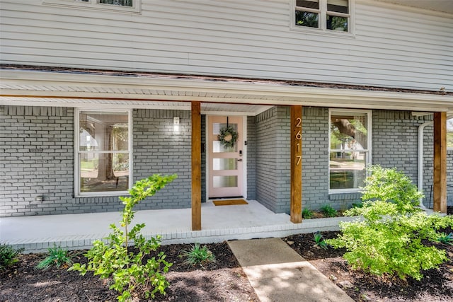 2617 Beechmont Dr, Dallas, TX 75228 - entrance to property featuring covered porch and brick siding