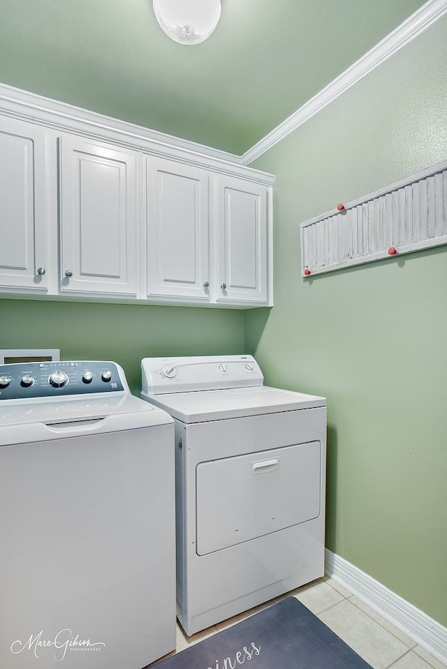 2198 Stockwell Rd, Bossier City, LA 71111 - laundry area featuring separate washer and dryer, cabinet space, light tile patterned floors, ornamental molding, and baseboards