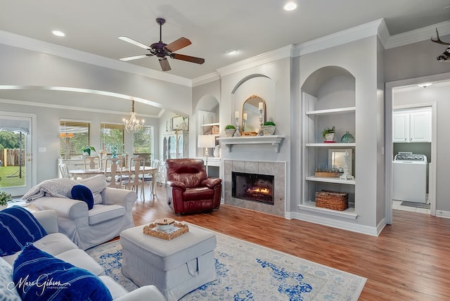 2198 Stockwell Rd, Bossier City, LA 71111 - living room with washer / dryer, healthy amount of natural light, ceiling fan, wood finished floors, and crown molding