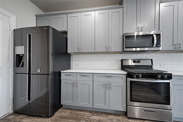 535 Teton St, Allen, TX 75002 - kitchen with stainless steel appliances, gray cabinets, light countertops, and tasteful backsplash
