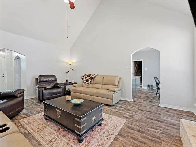 4710 Ashley Cir, Midlothian, TX 76065 - living room with arched walkways, high vaulted ceiling, dark wood-style floors, and a ceiling fan