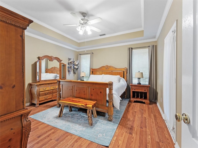 4710 Ashley Cir, Midlothian, TX 76065 - bedroom with light wood finished floors, a tray ceiling, ceiling fan, and ornamental molding
