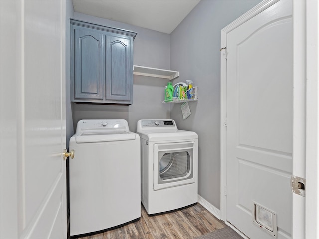 4710 Ashley Cir, Midlothian, TX 76065 - washroom with washer and clothes dryer, wood finished floors, and cabinet space