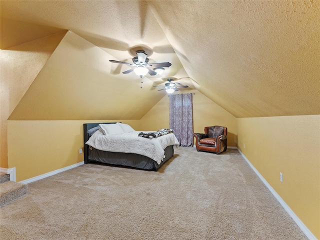 4710 Ashley Cir, Midlothian, TX 76065 - carpeted bedroom featuring vaulted ceiling, a textured ceiling, and a ceiling fan