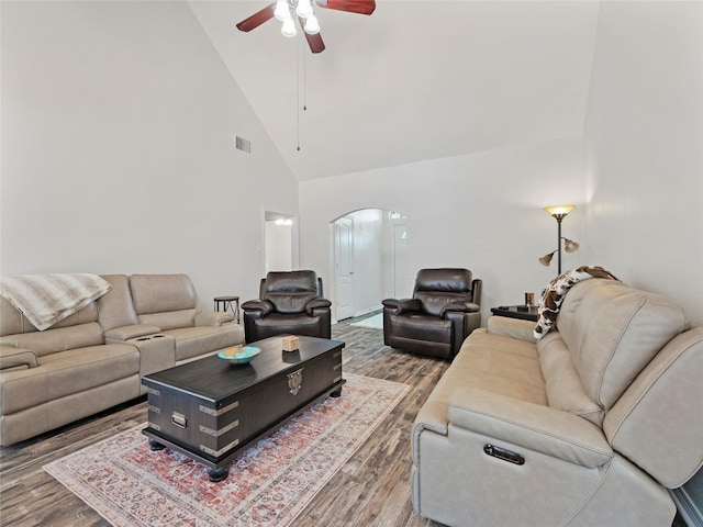 4710 Ashley Cir, Midlothian, TX 76065 - living area with arched walkways, wood finished floors, a ceiling fan, and high vaulted ceiling