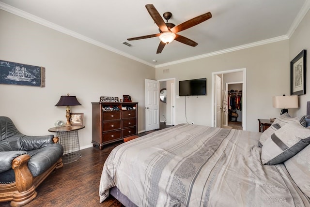 10237 Pyrite Dr, Fort Worth, TX 76131 - bedroom with ornamental molding, wood finished floors, a walk in closet, baseboards, and ceiling fan