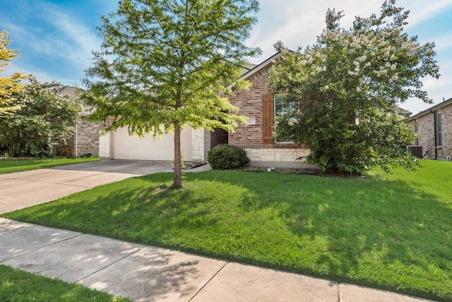 10237 Pyrite Dr, Fort Worth, TX 76131 - view of property hidden behind natural elements with driveway, brick siding, a front yard, an attached garage, and cooling unit