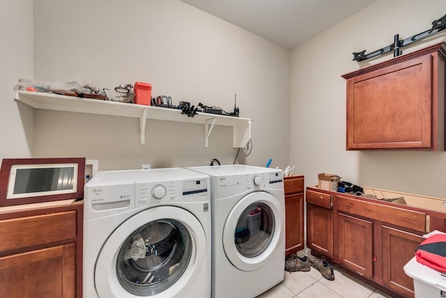10237 Pyrite Dr, Fort Worth, TX 76131 - laundry area with separate washer and dryer, light tile patterned floors, and cabinet space