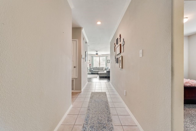 10237 Pyrite Dr, Fort Worth, TX 76131 - corridor with light tile patterned floors, ornamental molding, a textured wall, and baseboards