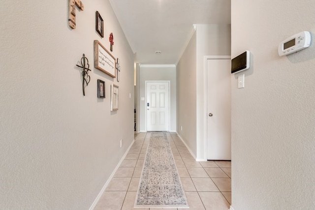 10237 Pyrite Dr, Fort Worth, TX 76131 - hall featuring light tile patterned floors, baseboards, and ornamental molding