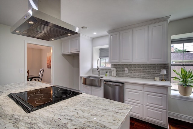 1220 Melony Dr, Sulphur Springs, TX 75482 - kitchen with wall chimney exhaust hood, dishwasher, a sink, cooktop, and tasteful backsplash