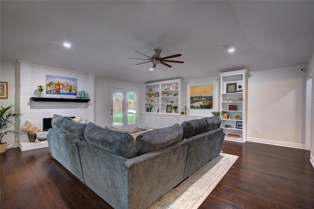 1220 Melony Dr, Sulphur Springs, TX 75482 - living room with ceiling fan, dark wood-type flooring, a fireplace, and recessed lighting