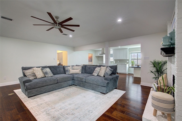 1220 Melony Dr, Sulphur Springs, TX 75482 - living room with a ceiling fan, dark wood finished floors, recessed lighting, baseboards, and a fireplace