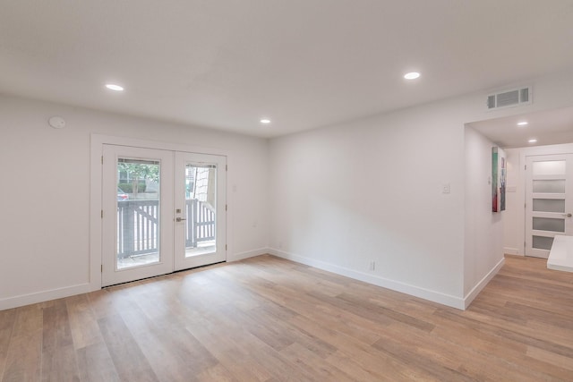 4851 Cedar Springs Rd Unit 175, Dallas, TX 75219 - spare room featuring french doors, light wood-type flooring, recessed lighting, baseboards, and a smoke detector