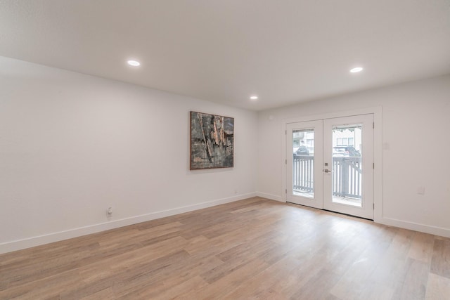 4851 Cedar Springs Rd Unit 175, Dallas, TX 75219 - empty room featuring french doors, light wood-style flooring, baseboards, and recessed lighting