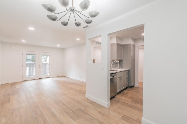 4851 Cedar Springs Rd Unit 175, Dallas, TX 75219 - kitchen featuring gray cabinetry, a chandelier, light wood-style flooring, stainless steel dishwasher, and recessed lighting